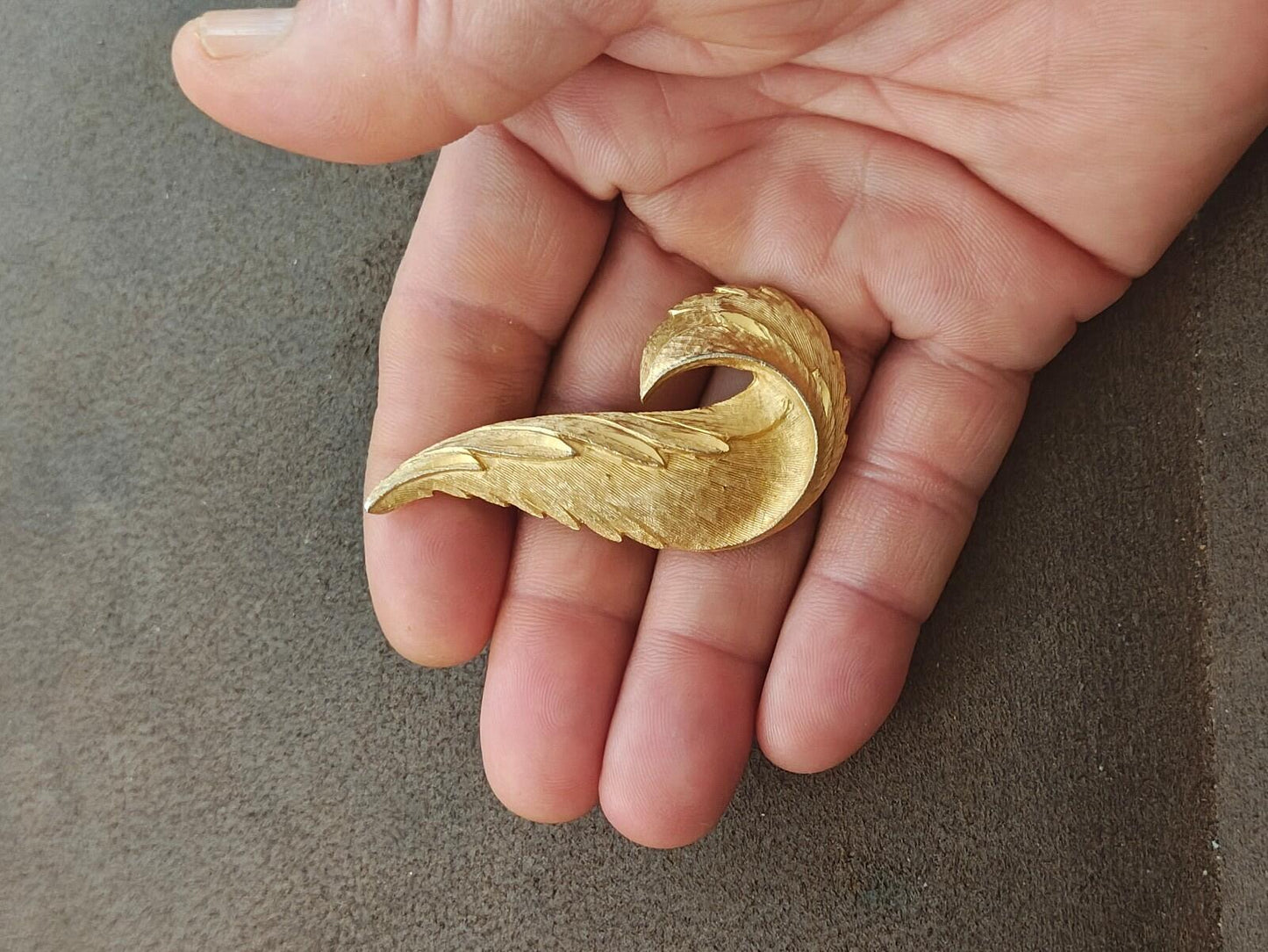 1960s Gold Tone Textured Feather Swirl Brooch
