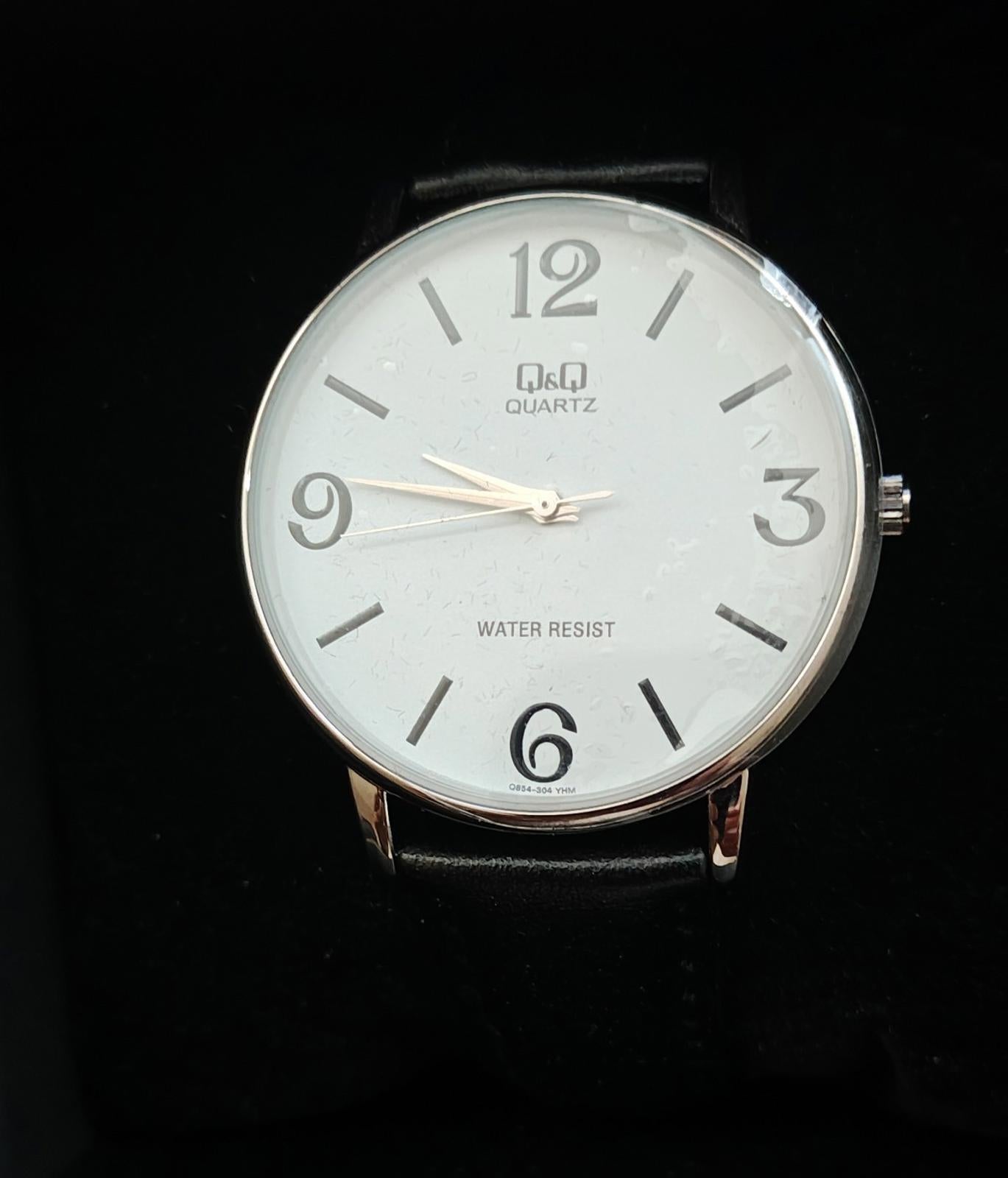Q&Q Men's Analog Wrist Watch With White Dial and Black Leather Band.