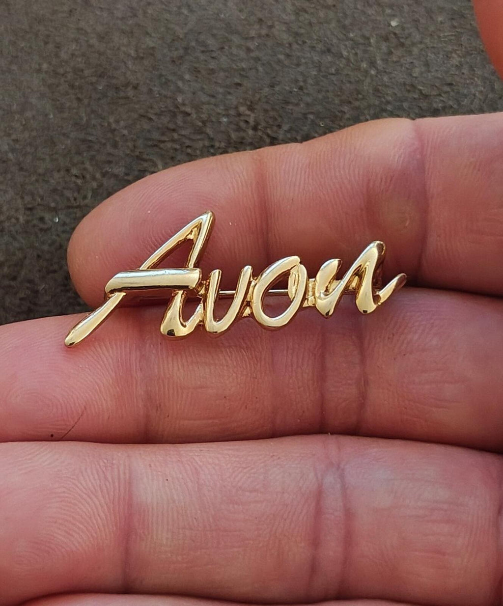 1980s/90s  Avon Gold Tone Cursive Logo Pin