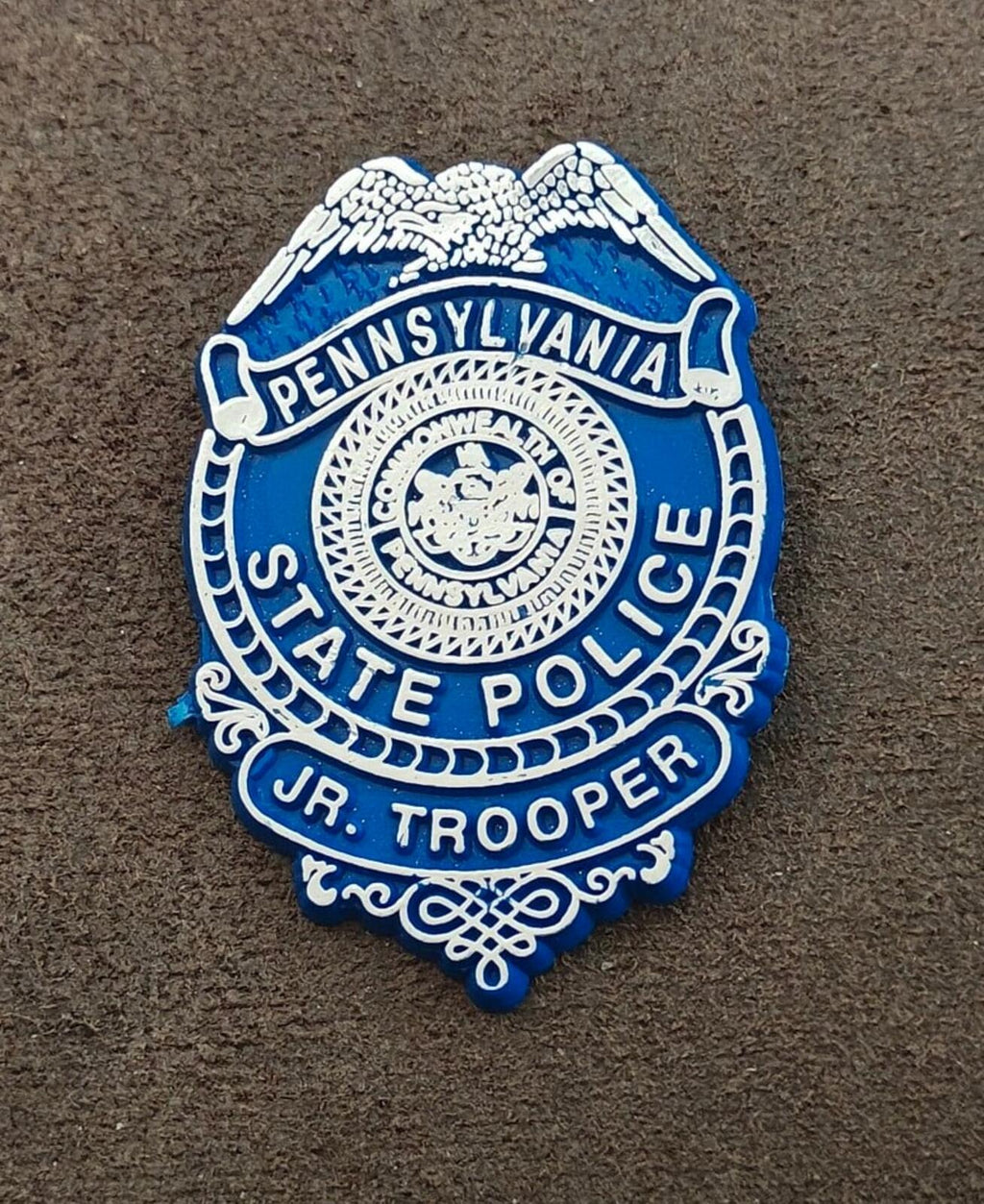 Pennsylvania State Police Jr. Trooper badge, centered front design, blue and white