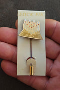 Gold tone stick pin with baseball glove and “SPECIAL” plaque on display card