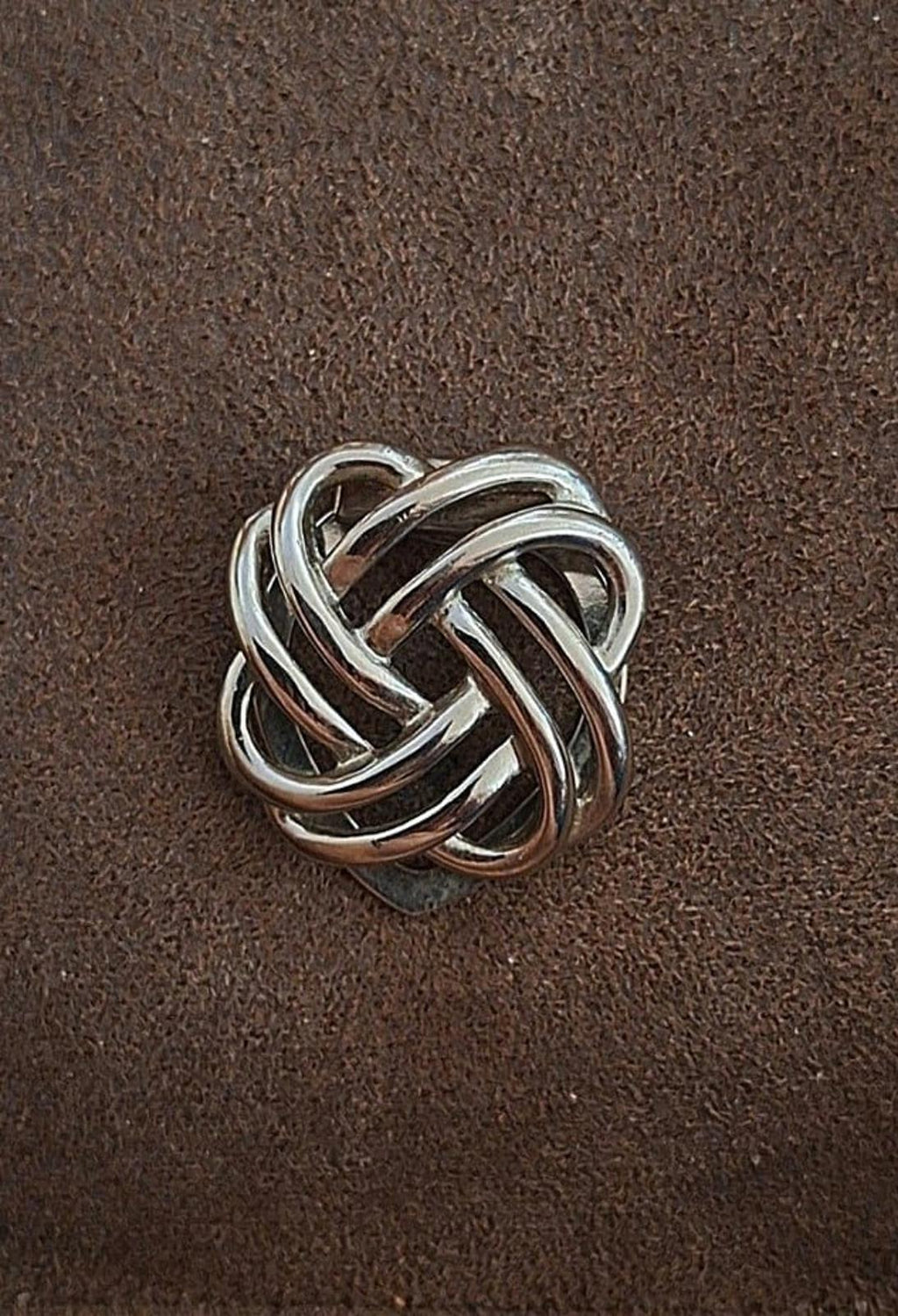 Silver love-knot scarf clip, front view of braided metal loops