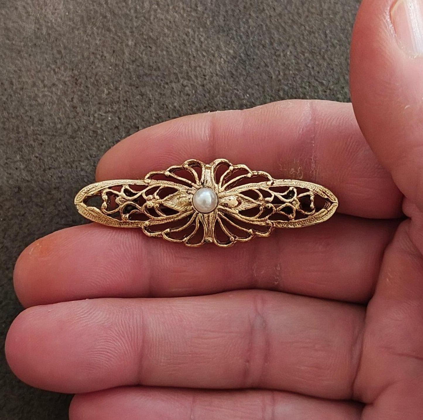1980s Victorian Style Gold Tone Bar Brooch With a Central Faux Pearl Accent