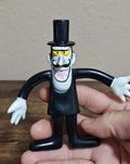 Black bendable collectible cartoon figure with white hands, yellow eyes, and black top hat.