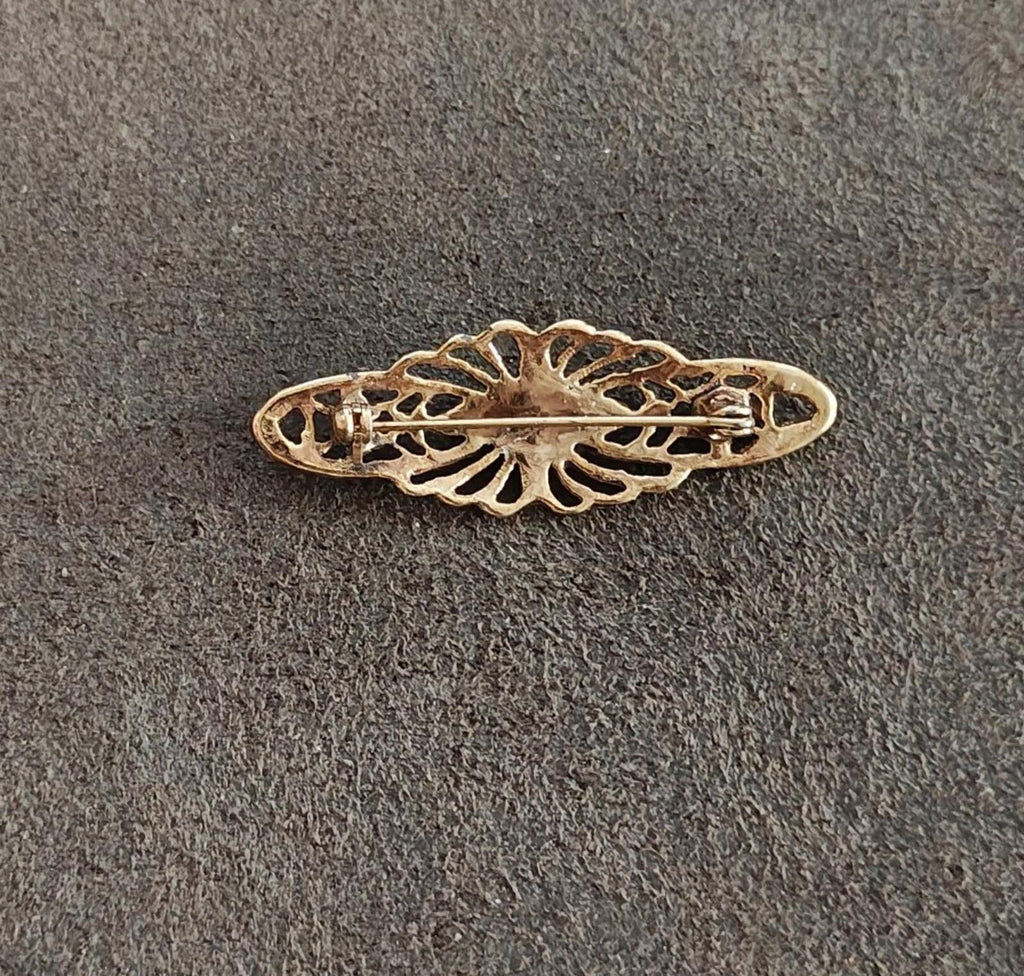 Gold-tone Victorian bar brooch underside with filigree openwork details