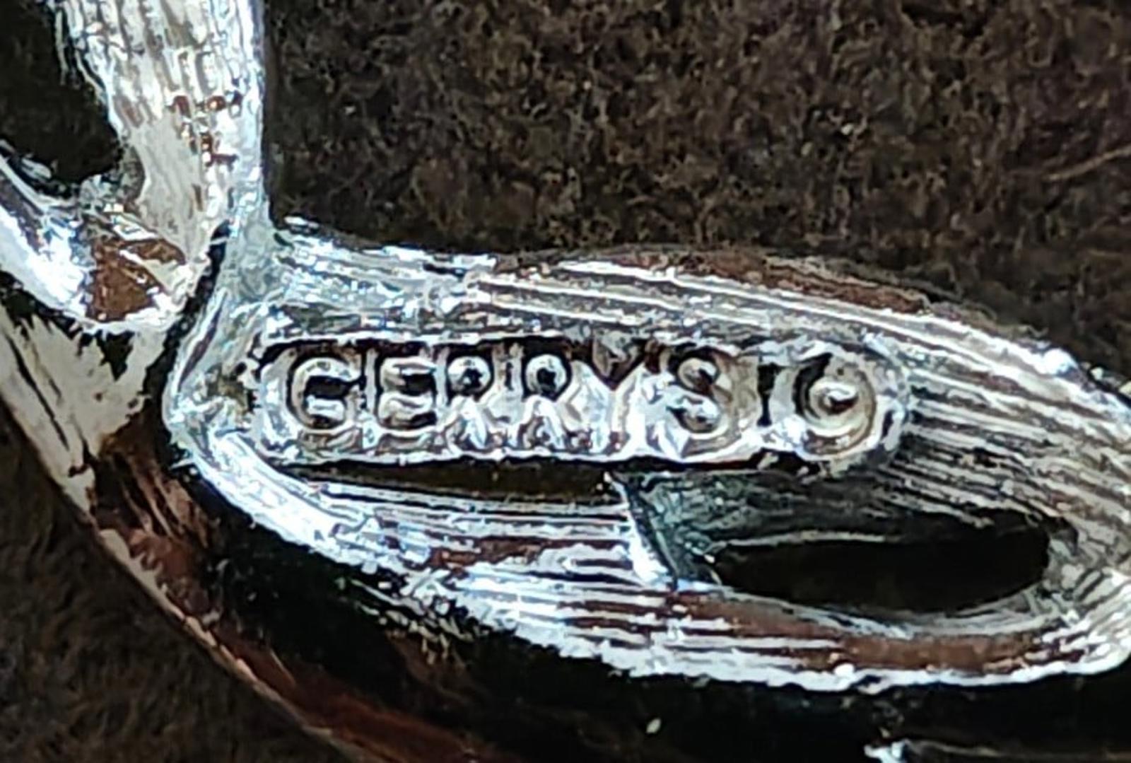 Signed Gerry's silver-tone pin brooch clasp area with engraved mark