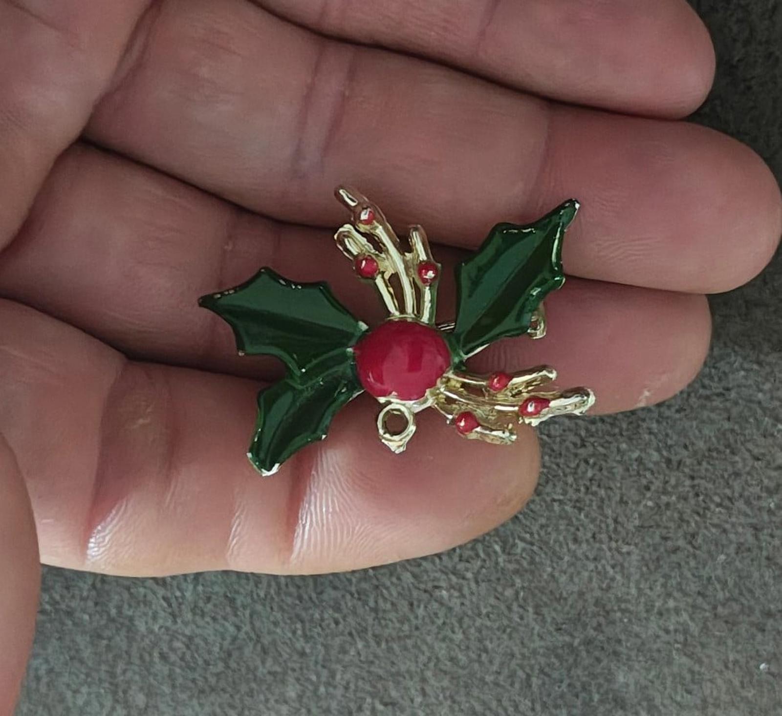 Holly enamel brooch pin with glossy green leaves, red berry, and gold-tone curved arms