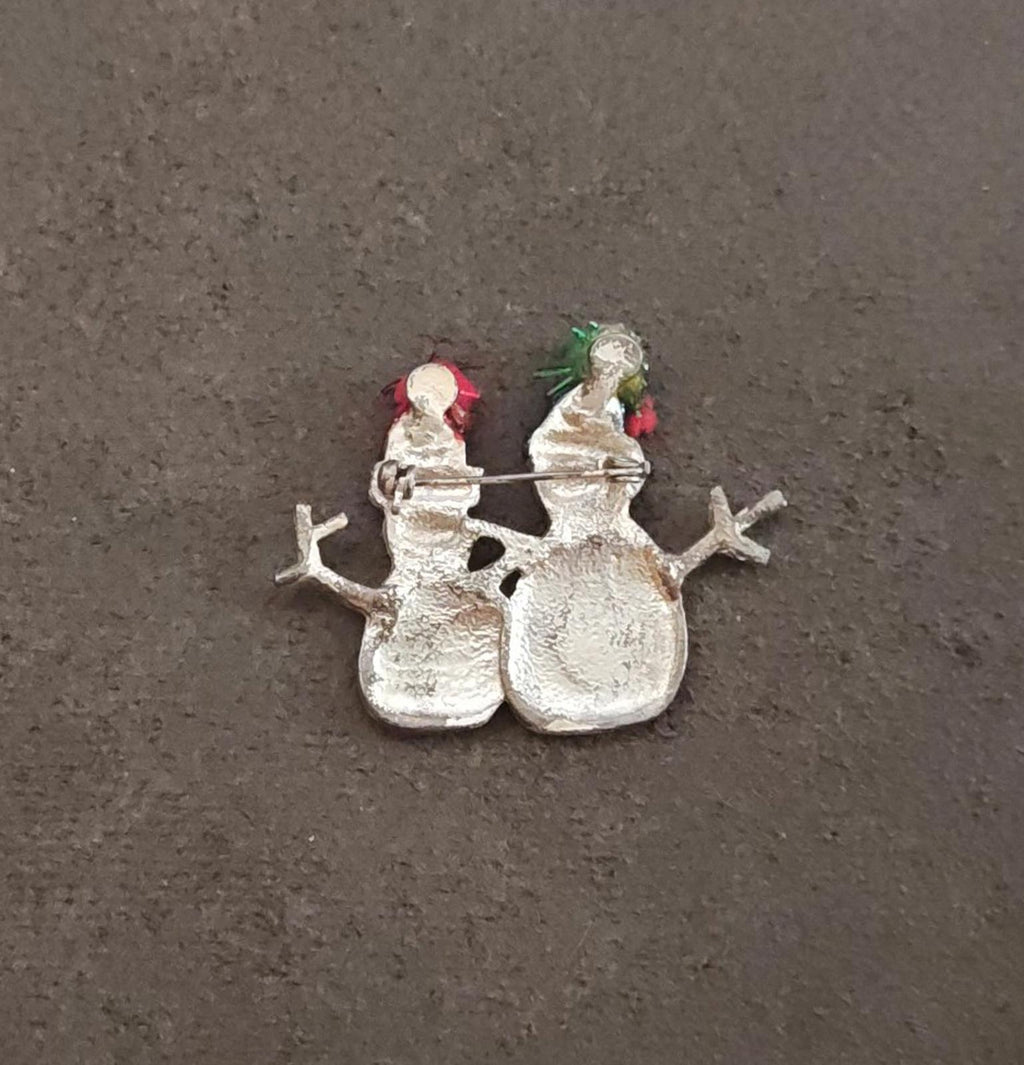 Two snowman enamel brooch backside in silver tone, with green and red top details