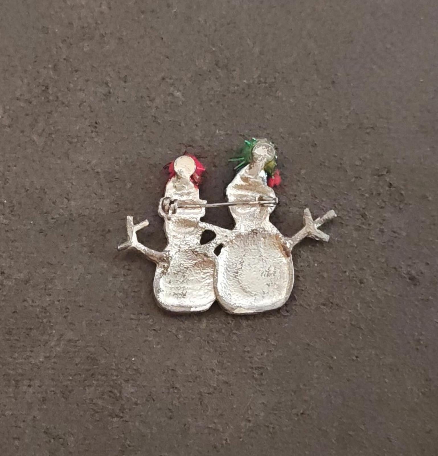 Two snowman enamel brooch backside in silver tone, with green and red top details