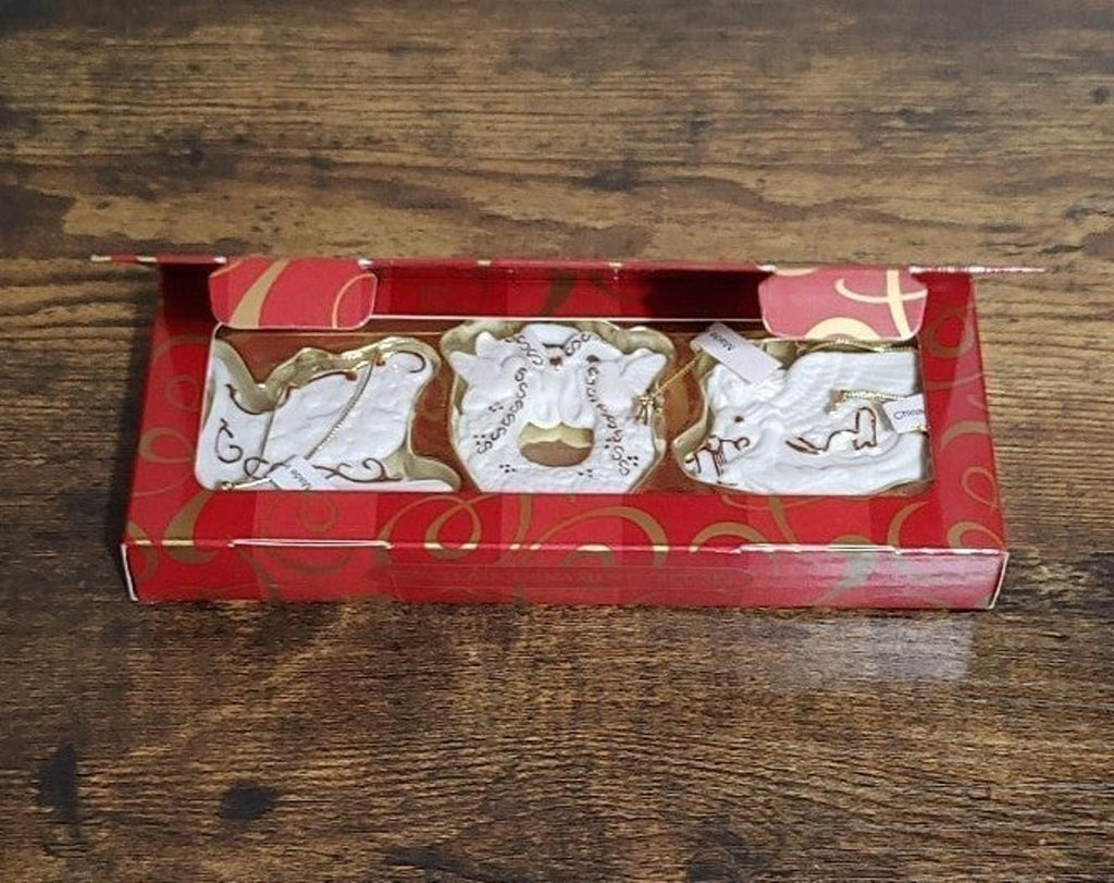 Set of three bisque porcelain ornaments in red gift box with gold trim
