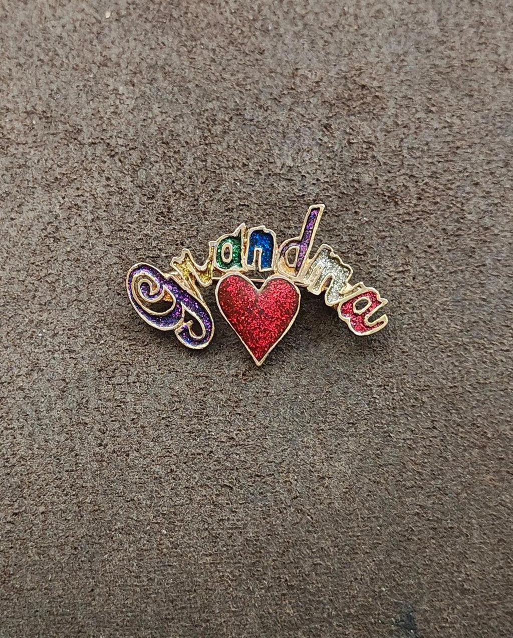 Gold tone grandma brooch with red glitter heart and colorful enamel letters