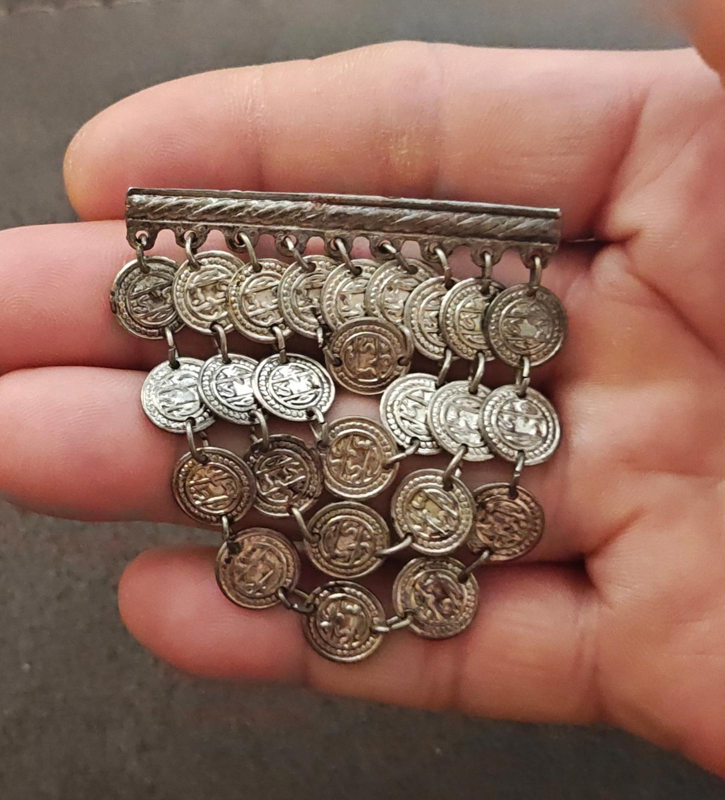 Silver-tone coin dangle brooch with rectangular bar and multiple hanging coin charms