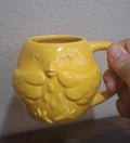 Yellow ceramic mug with 3D chick embossing and rounded handle