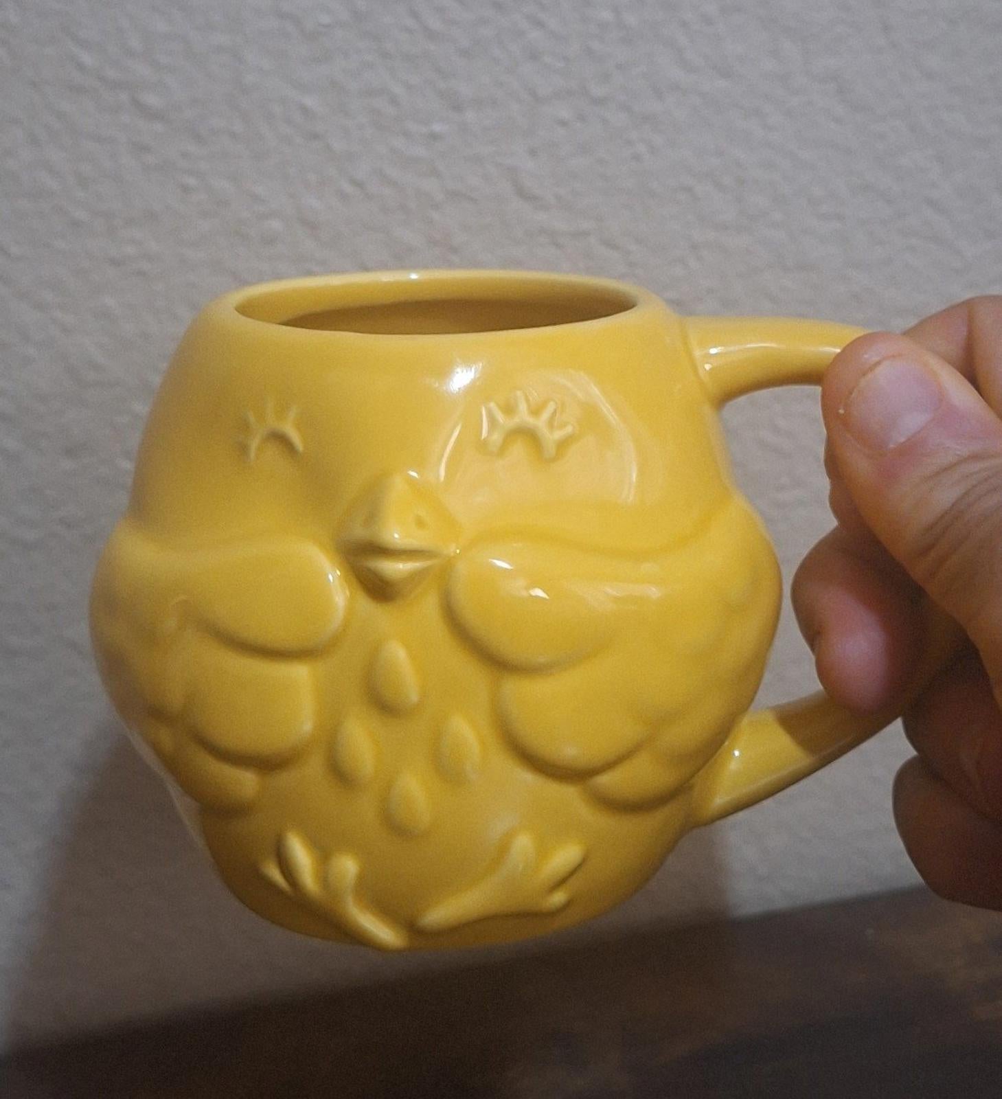 Yellow ceramic mug with 3D chick embossing and rounded handle