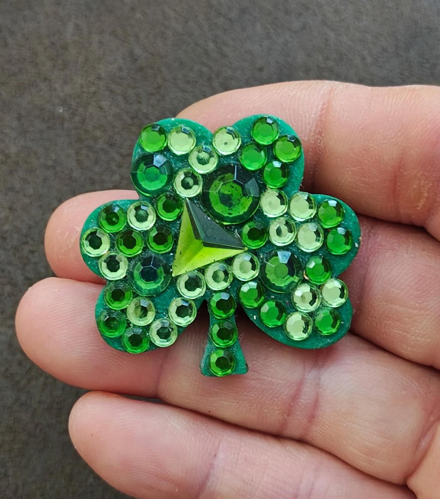 Green jeweled shamrock brooch pin with faceted rhinestones and bright star center