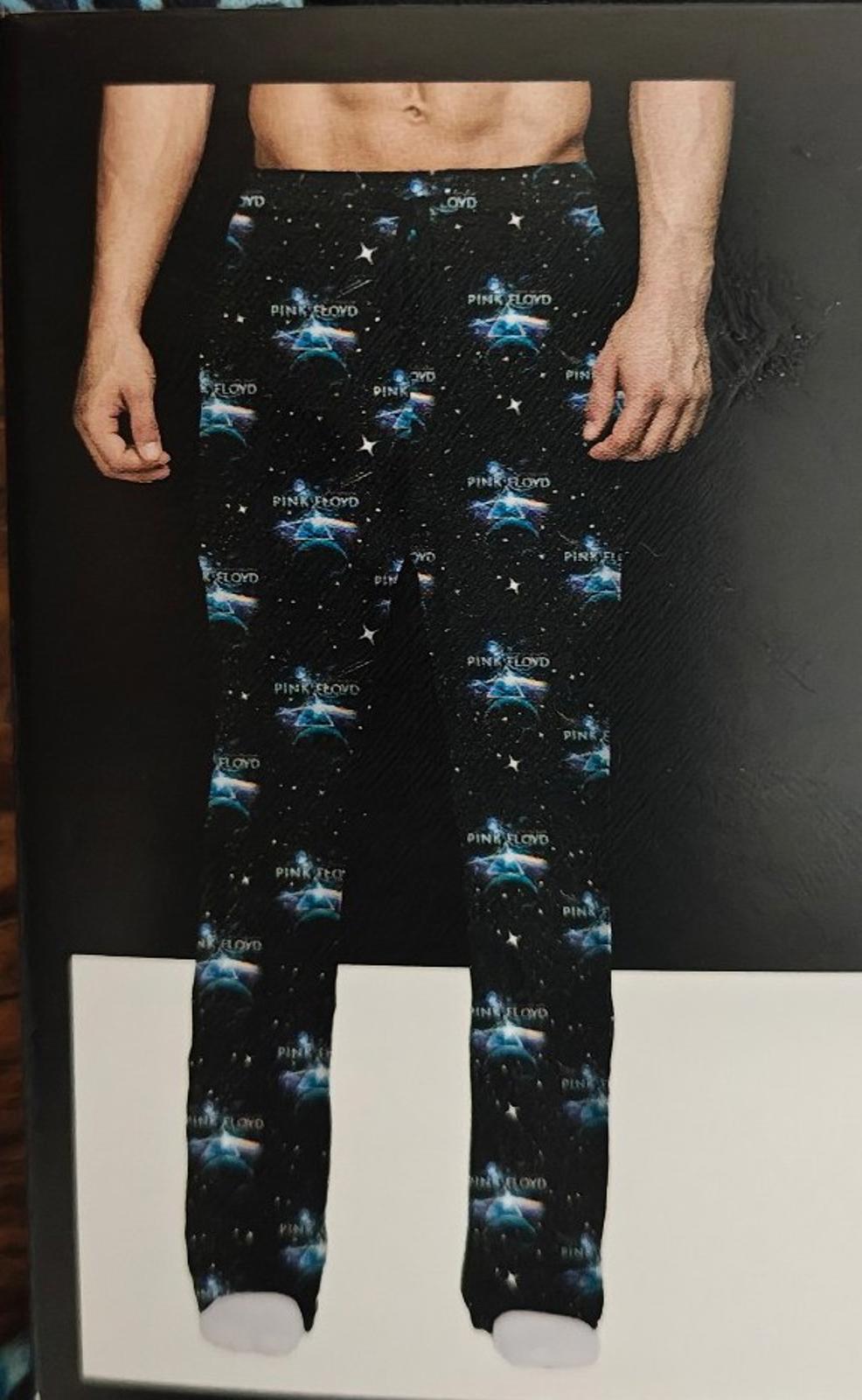 Black graphic sleep pants worn, with starry blue print and full-length legs