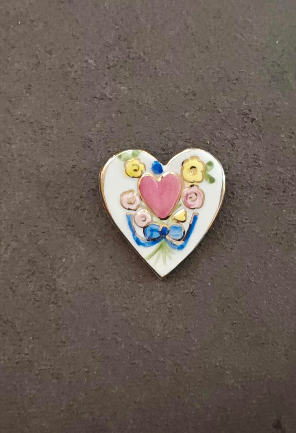 Heart-shaped ceramic brooch pin, pink heart motif with yellow and pink flower details