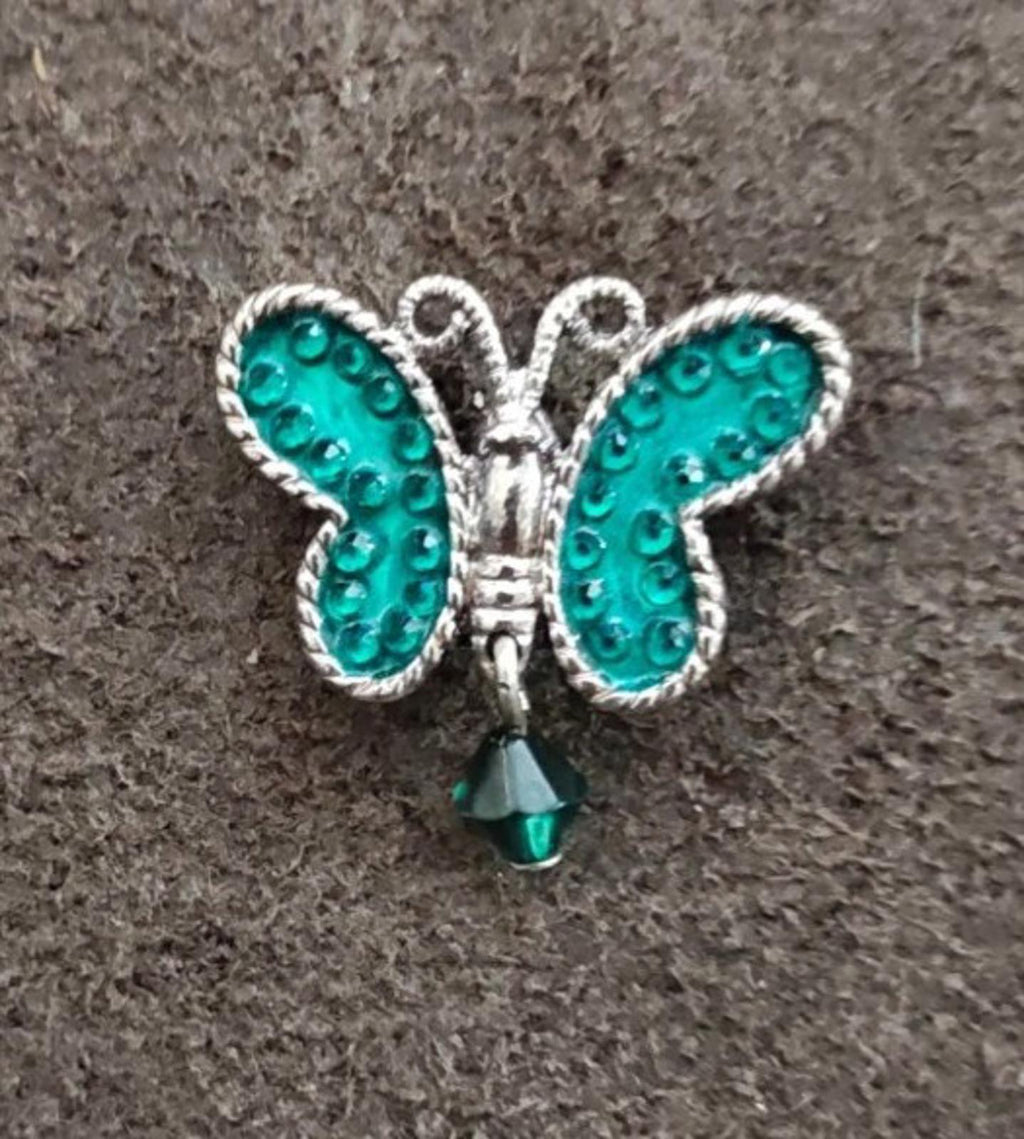 Silver-tone butterfly dangle pin with teal enamel wings and dangling teardrop charm
