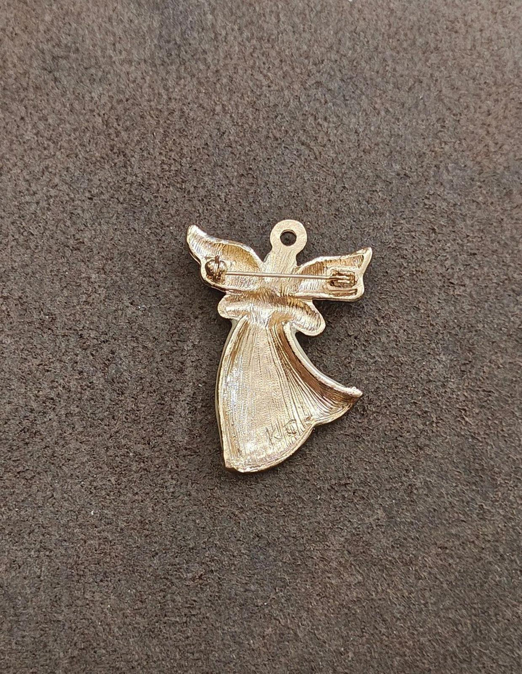 Gold-tone angel brooch back view with pin mechanism and textured angel detailing