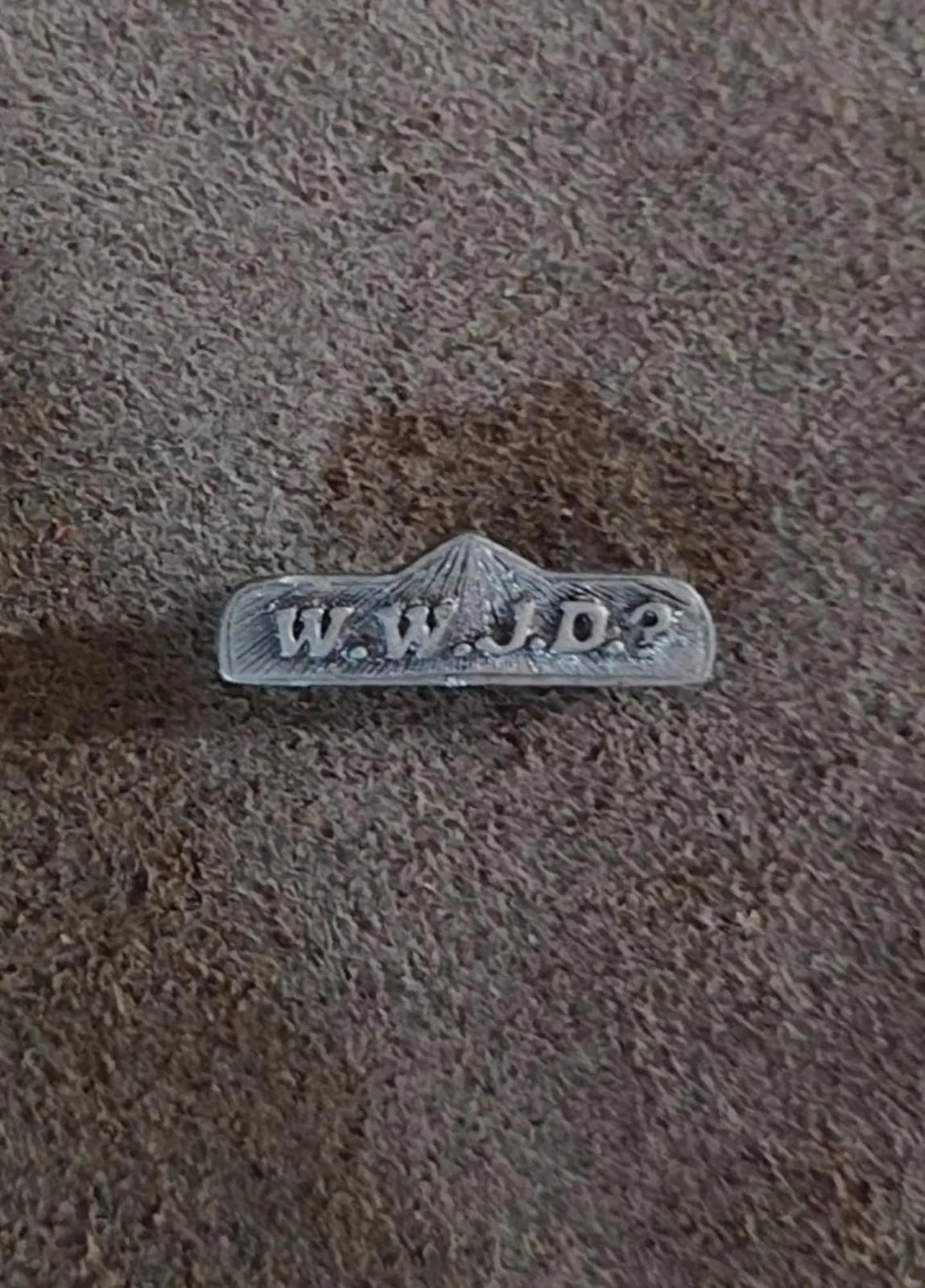 Pewter WWJD bar religious pin with raised WWJD text across the bar