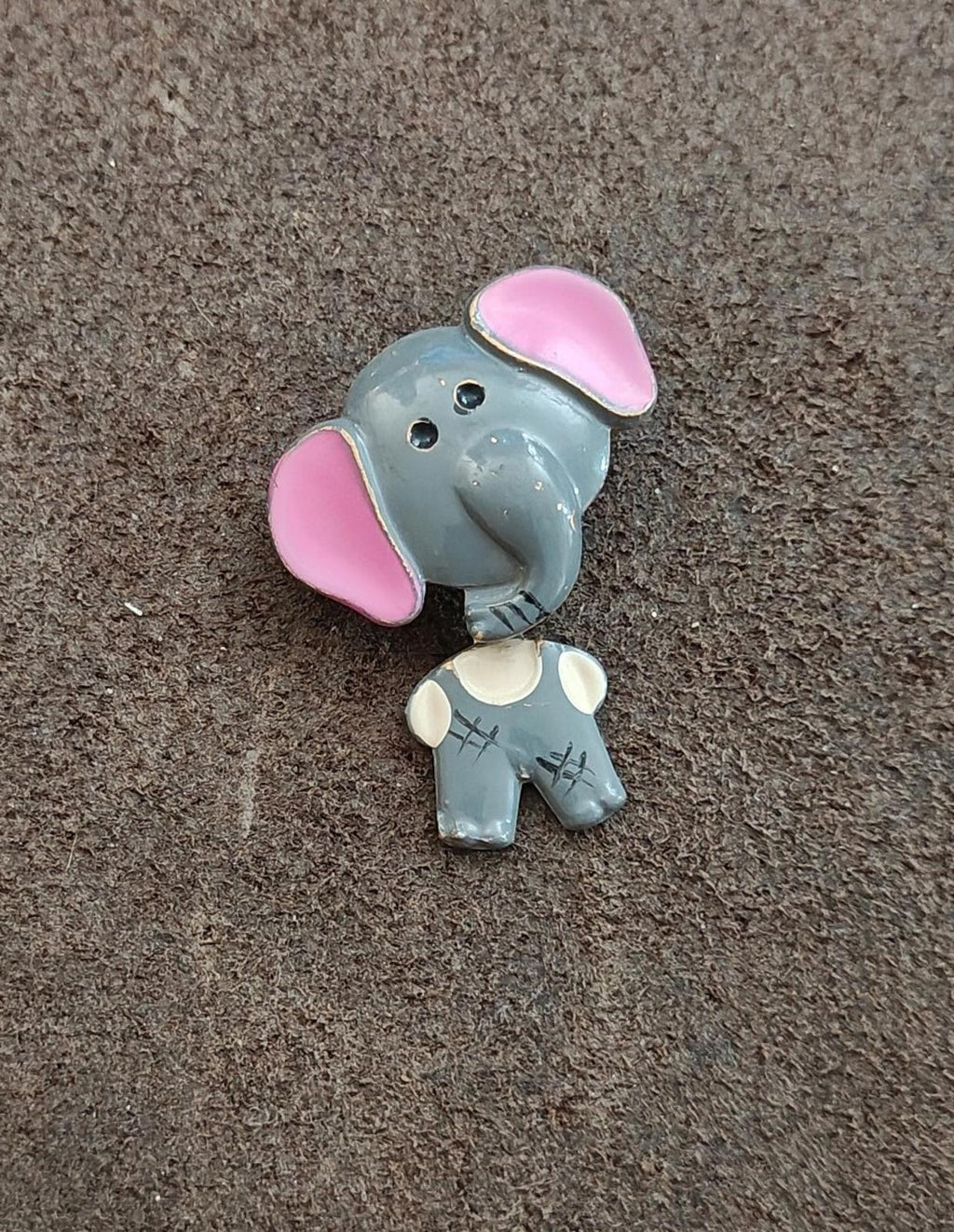 Angled elephant enamel brooch, light gray head, pink ears, white shirt with small accents