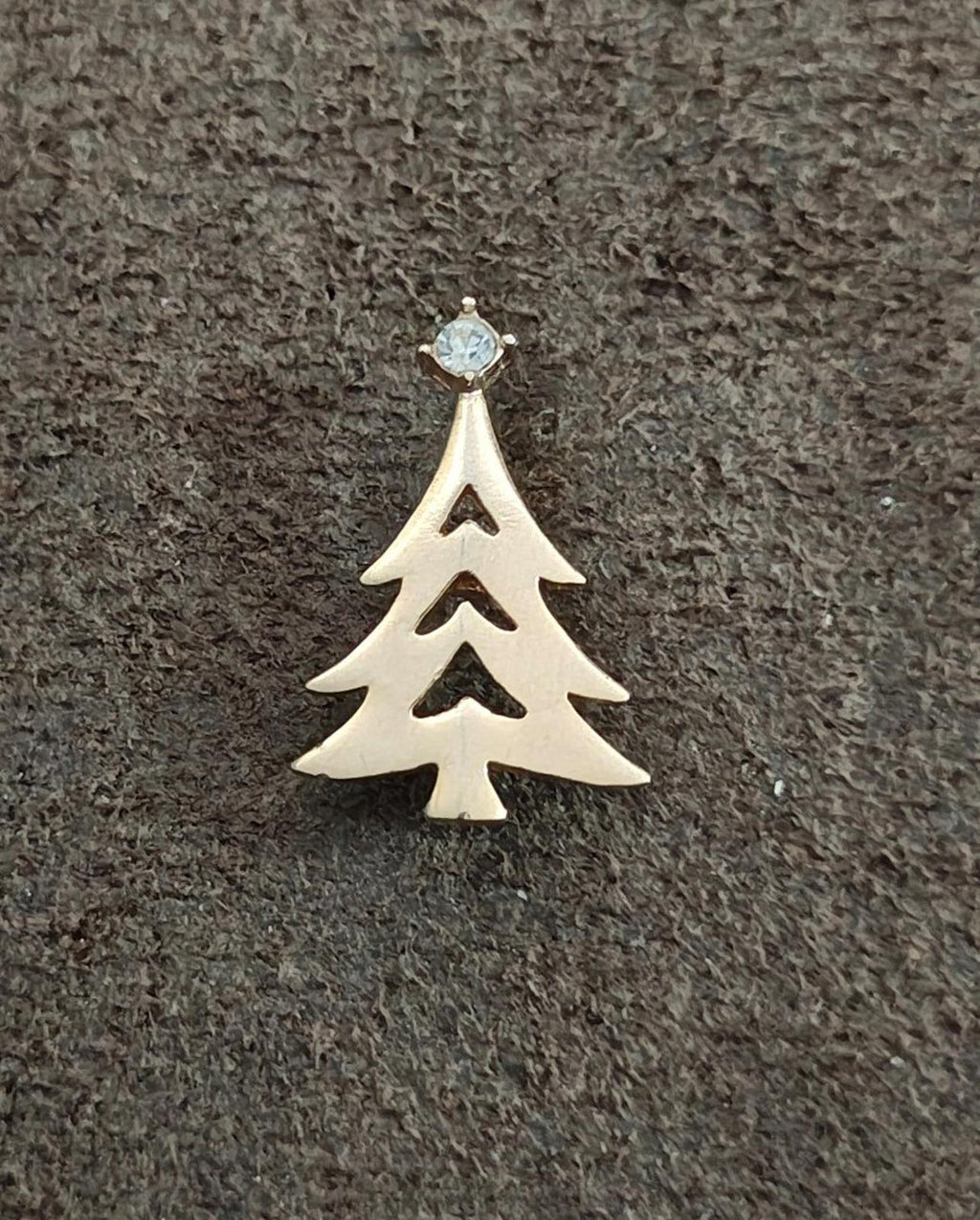 Gold-tone Christmas tree charm with clear rhinestone top, three tree tiers