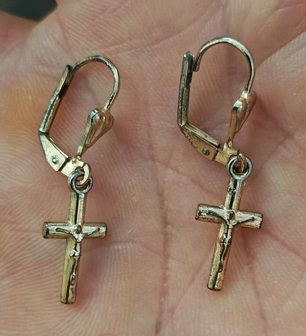 Gold-tone cross dangle earrings with heart-shaped top loops and hook backs.