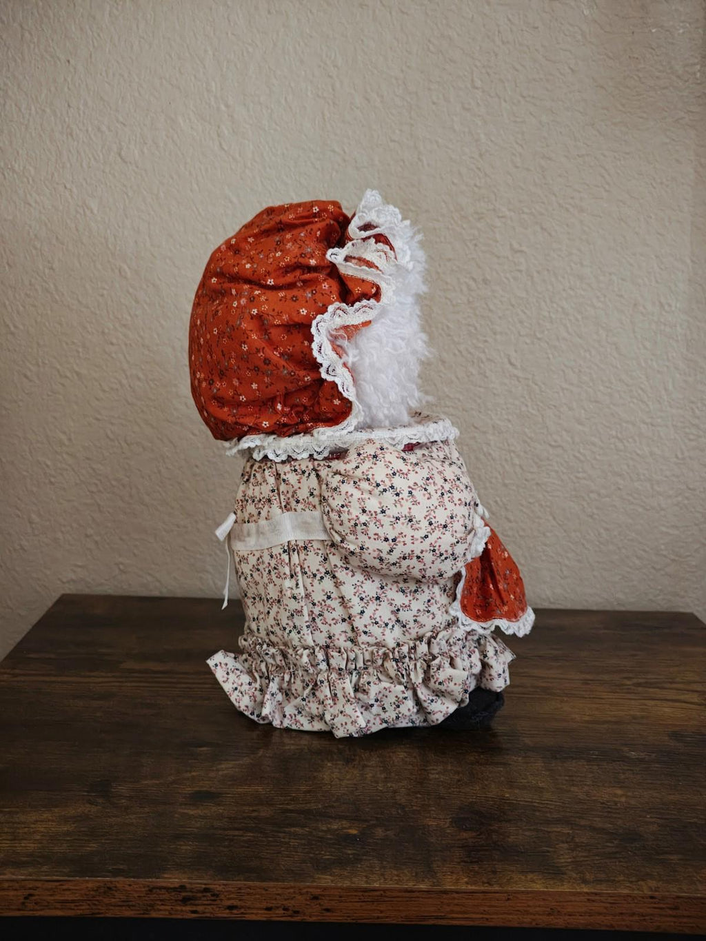 Handmade cloth doll canister top opening view with fabric lining and black patch.