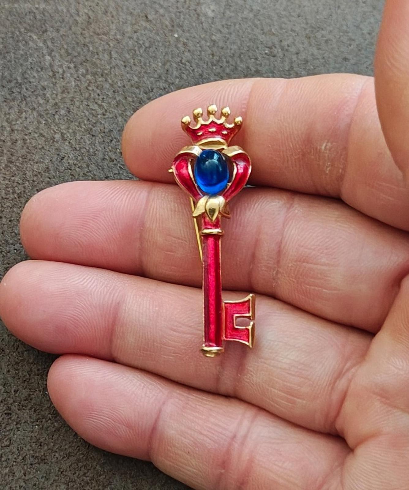 1940s/50s Crown Trifari Gold Tone Key Brooch With Red Enamel and Blue Cabochon