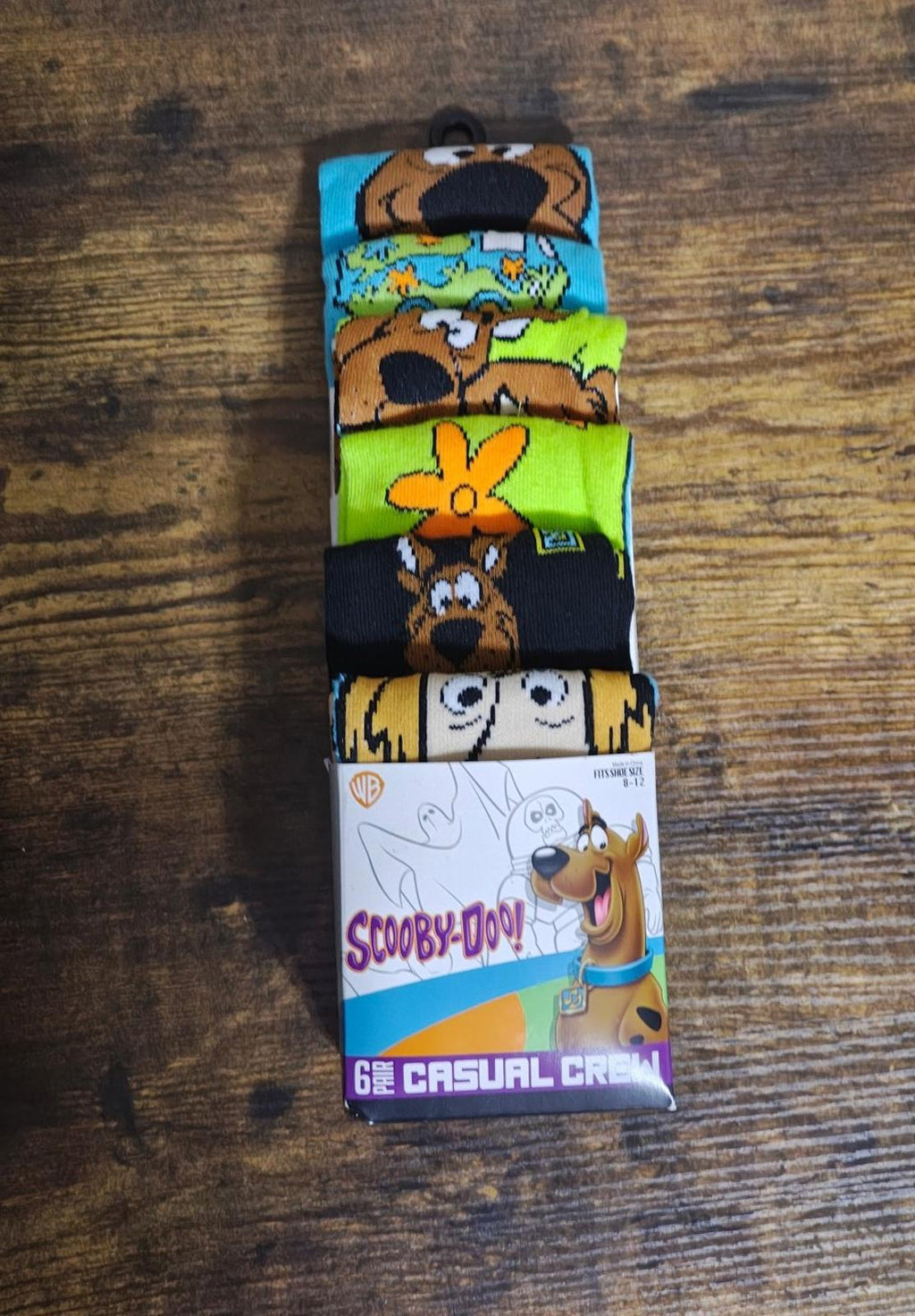 Men's casual crew socks 6-pack on display with colorful character graphics.