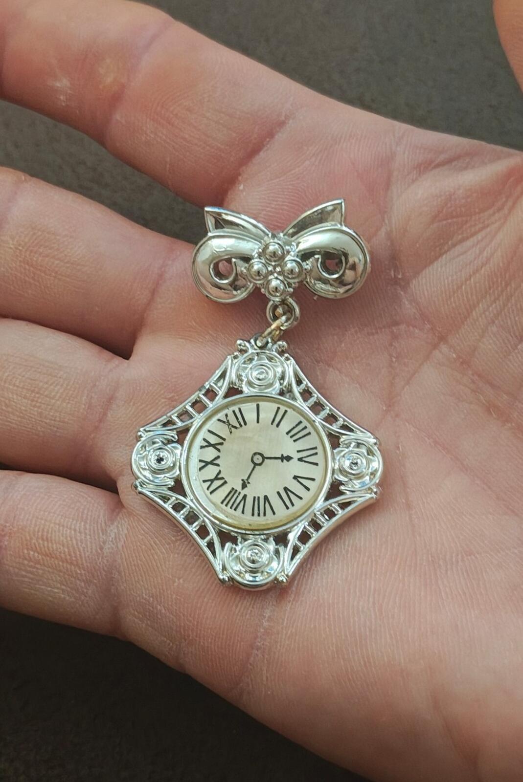 1980s Silver Tone Art Deco Style Bow Clock Motif Dangle Brooch