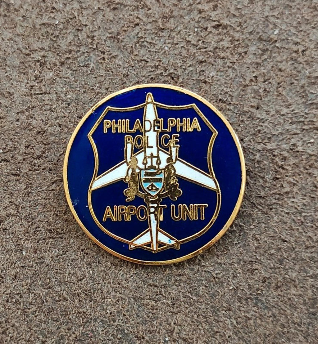 Blue and gold round Philadelphia Police Airport Unit badge pin with airplane icon