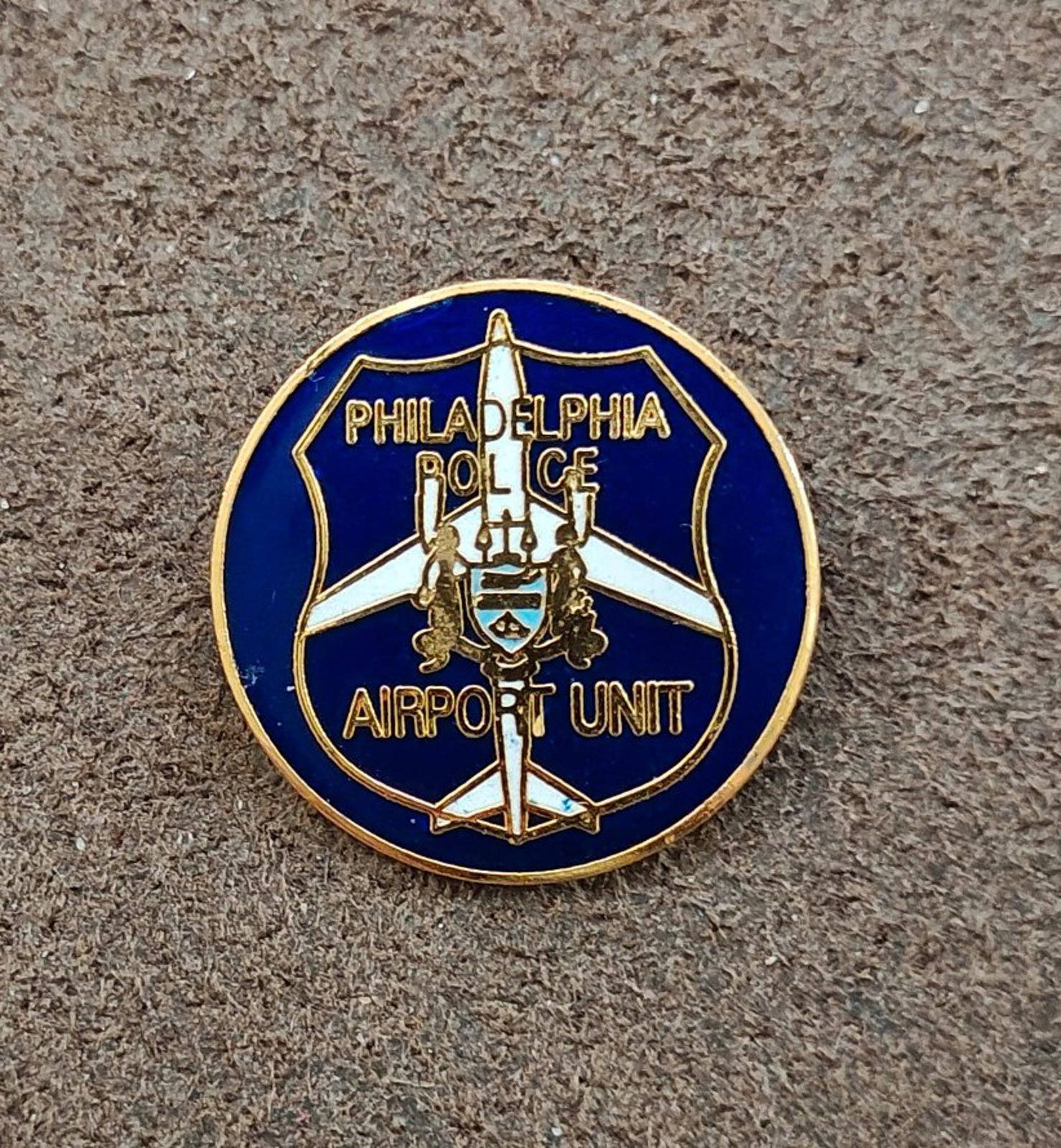 Blue and gold round Philadelphia Police Airport Unit badge pin with airplane icon