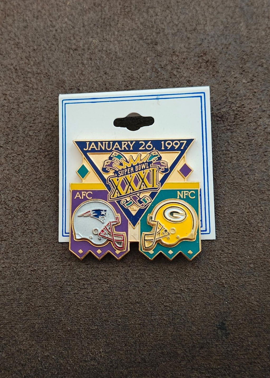 Super Bowl XXXI commemorative pin on card with AFC and NFC team logos and date