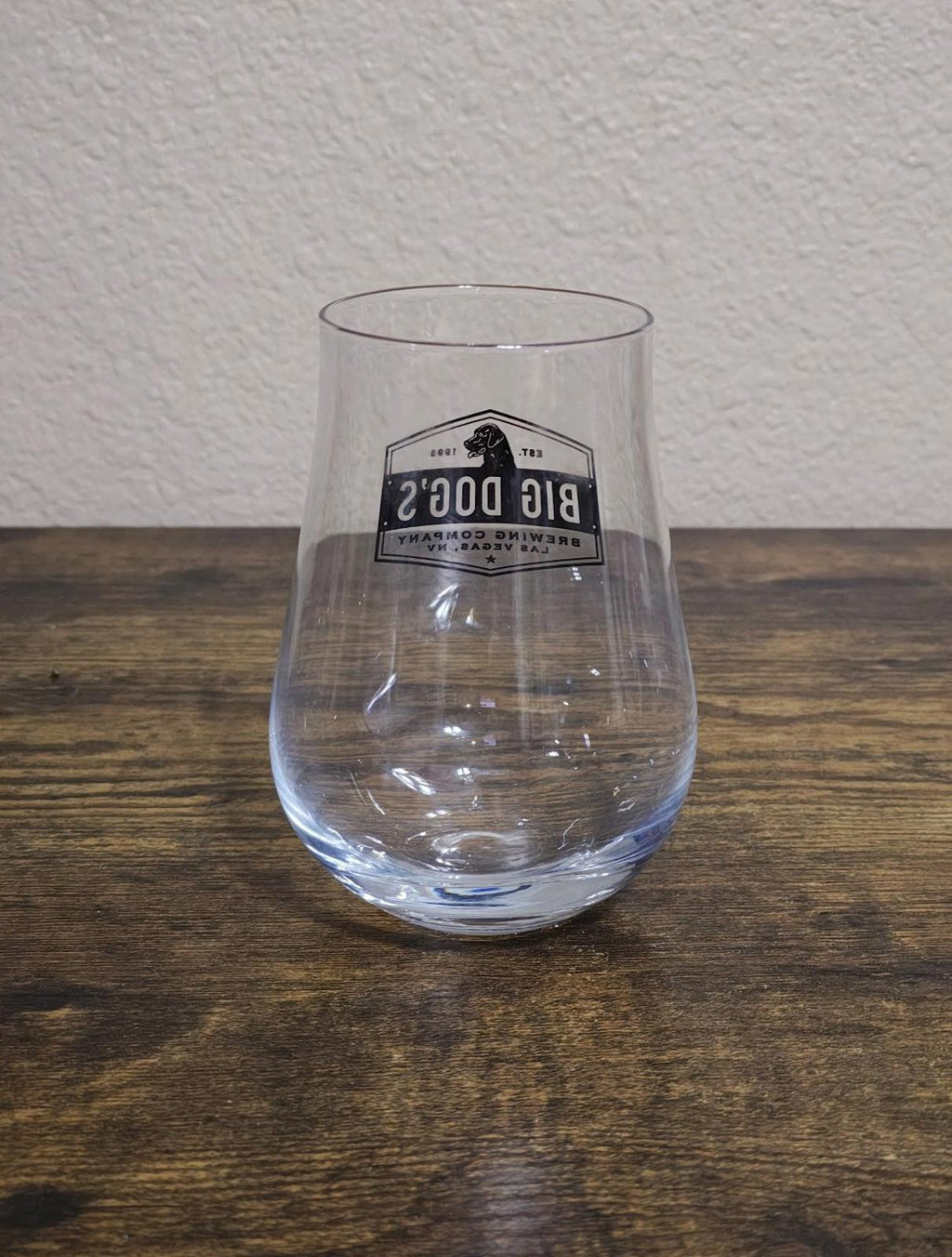 Clear stemless wine/beer glass with Big Dog's Brewing Company logo on front