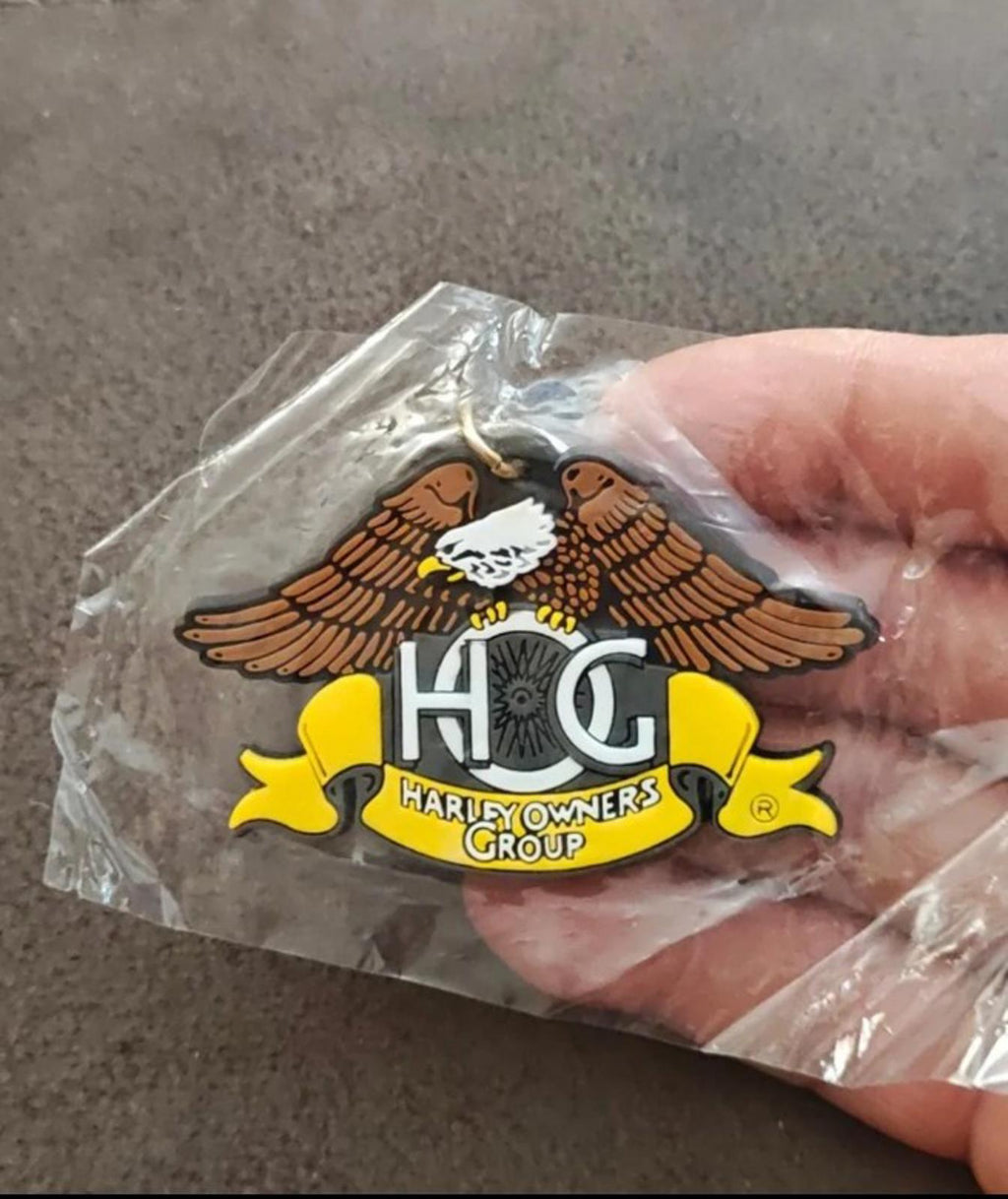 Harley-Davidson Owners Group rubber keychain fob with eagle wings and H.O.G. lettering