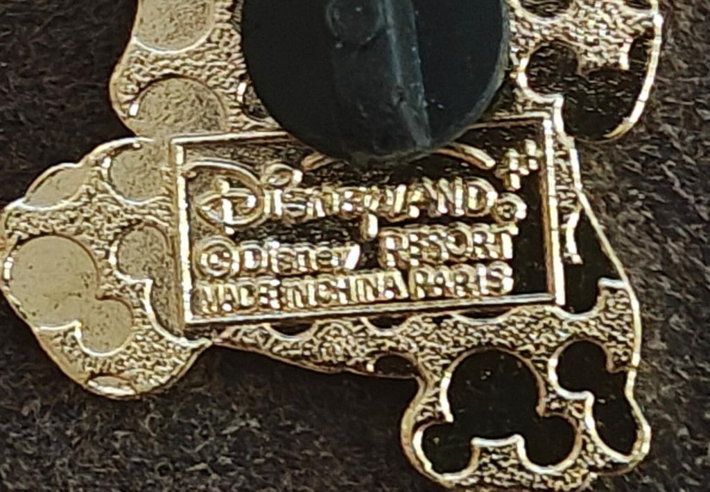Enamel pin back close-up with gold text and Made in China line, black post