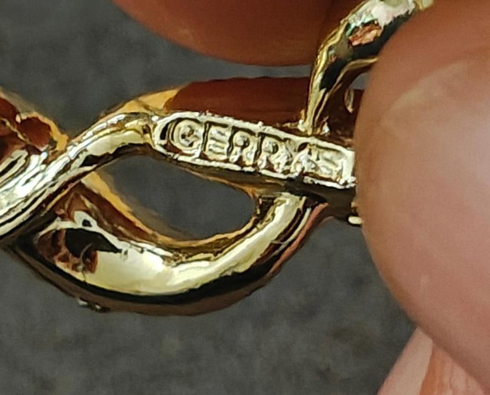 GERRYS marked gold-tone brooch pin clasp with leaf-link design