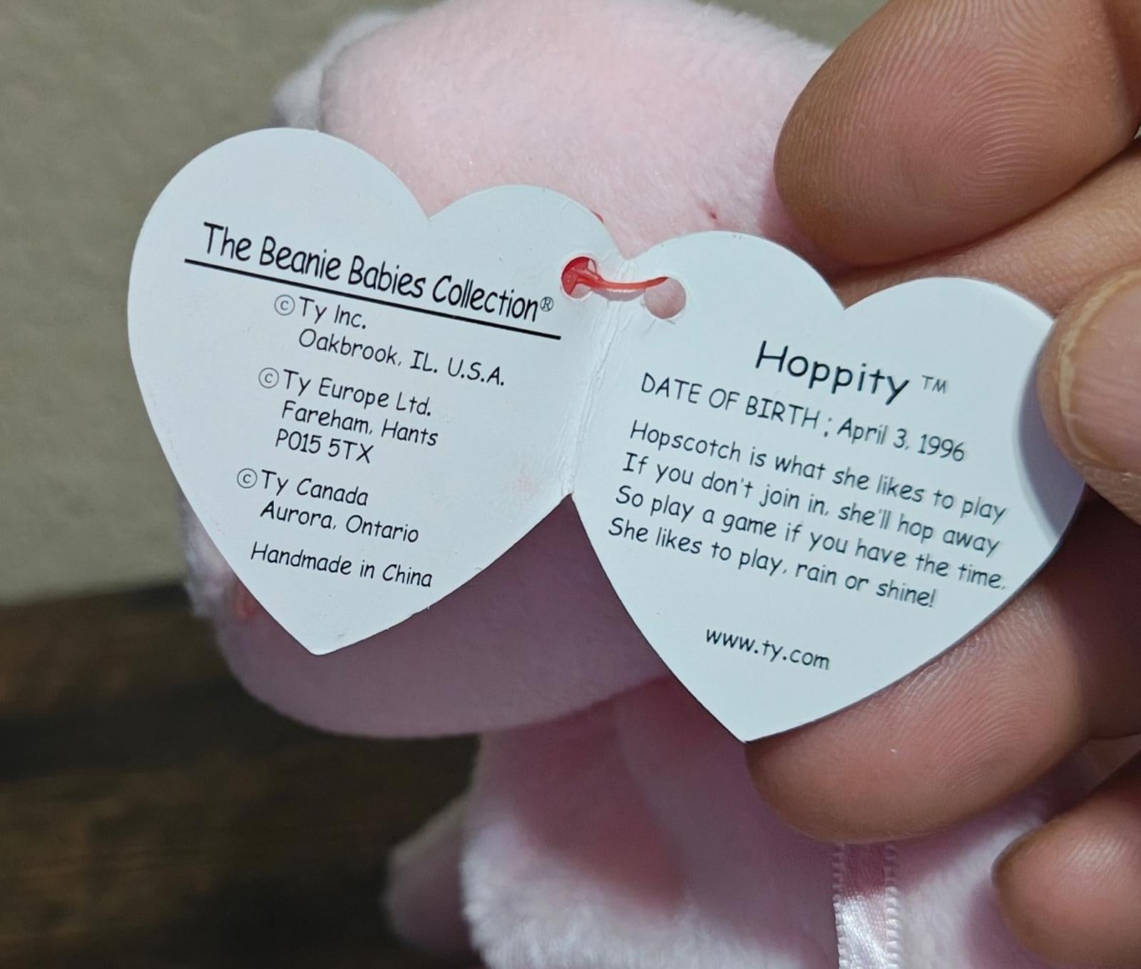 Pink heart hang tag with printed bunny details and date text