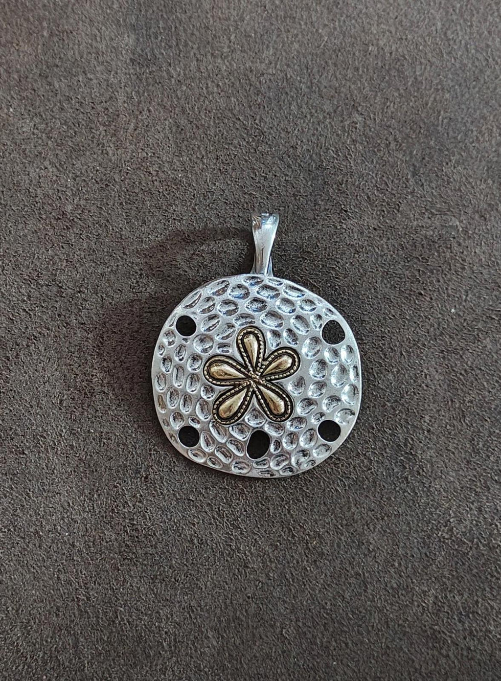 Silver round pendant with openwork dot pattern and two-tone five-petal flower