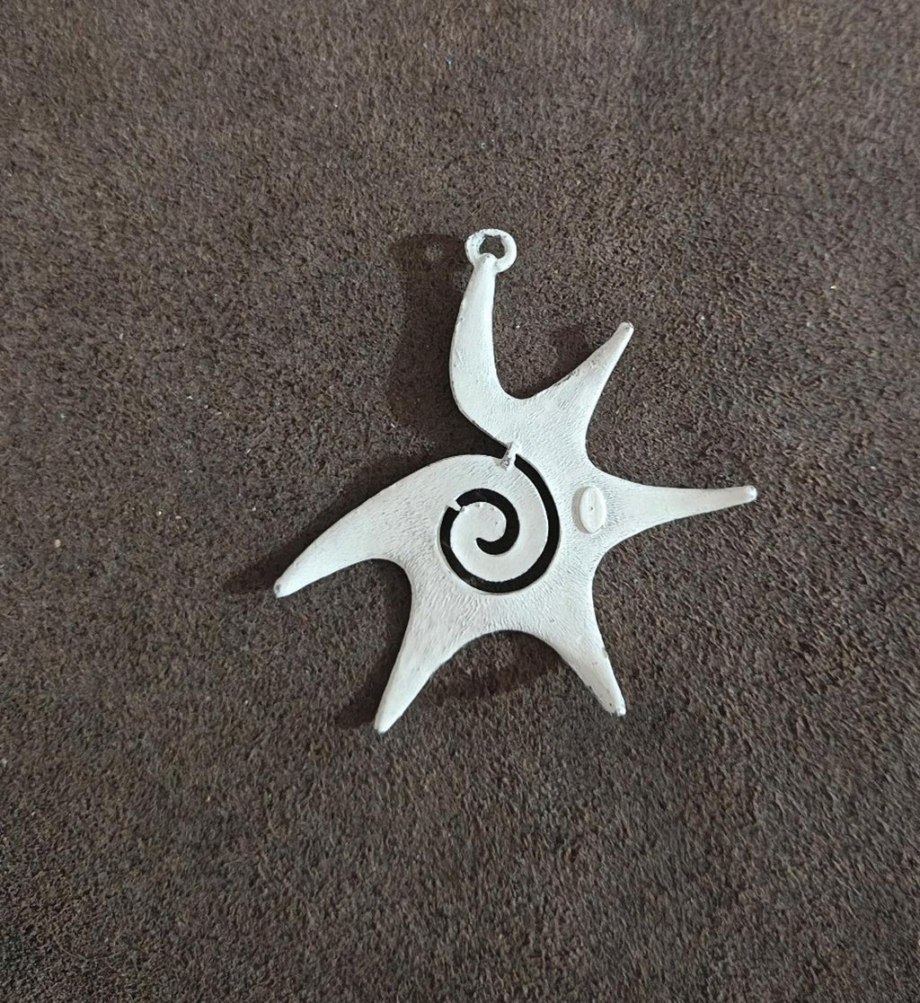 White enamel star pendant with spiral swirl center and loop bail top