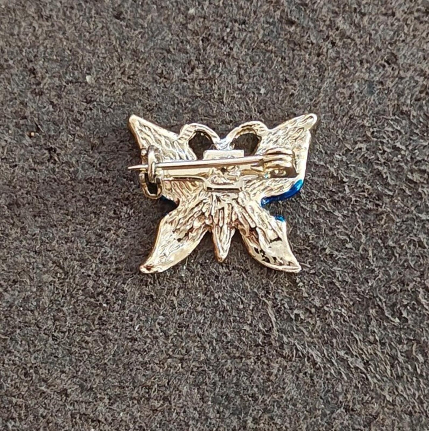 1980s Gold Tone Blue Enamel Butterfly Brooch Accented With Clear Rhinestones