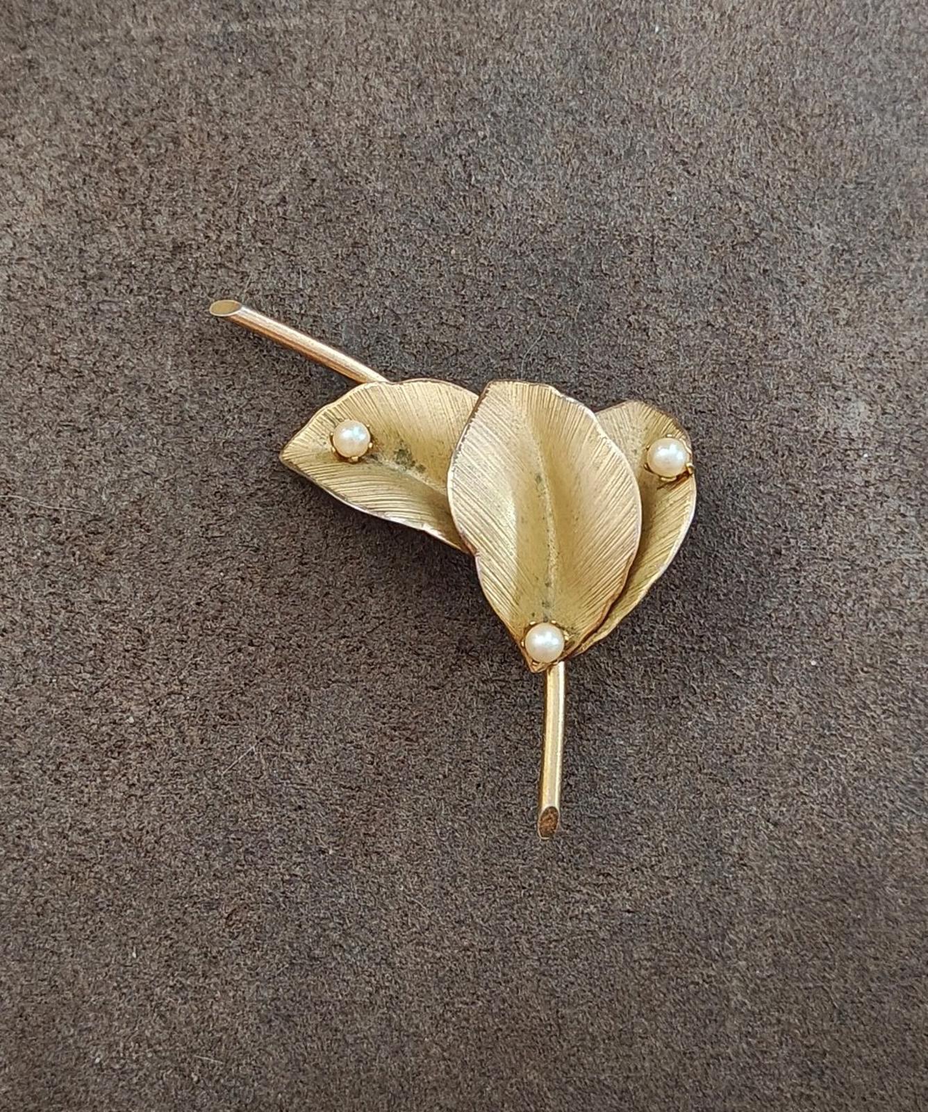 Gold textured leaf pin brooch with three faux pearls and a straight stick pin