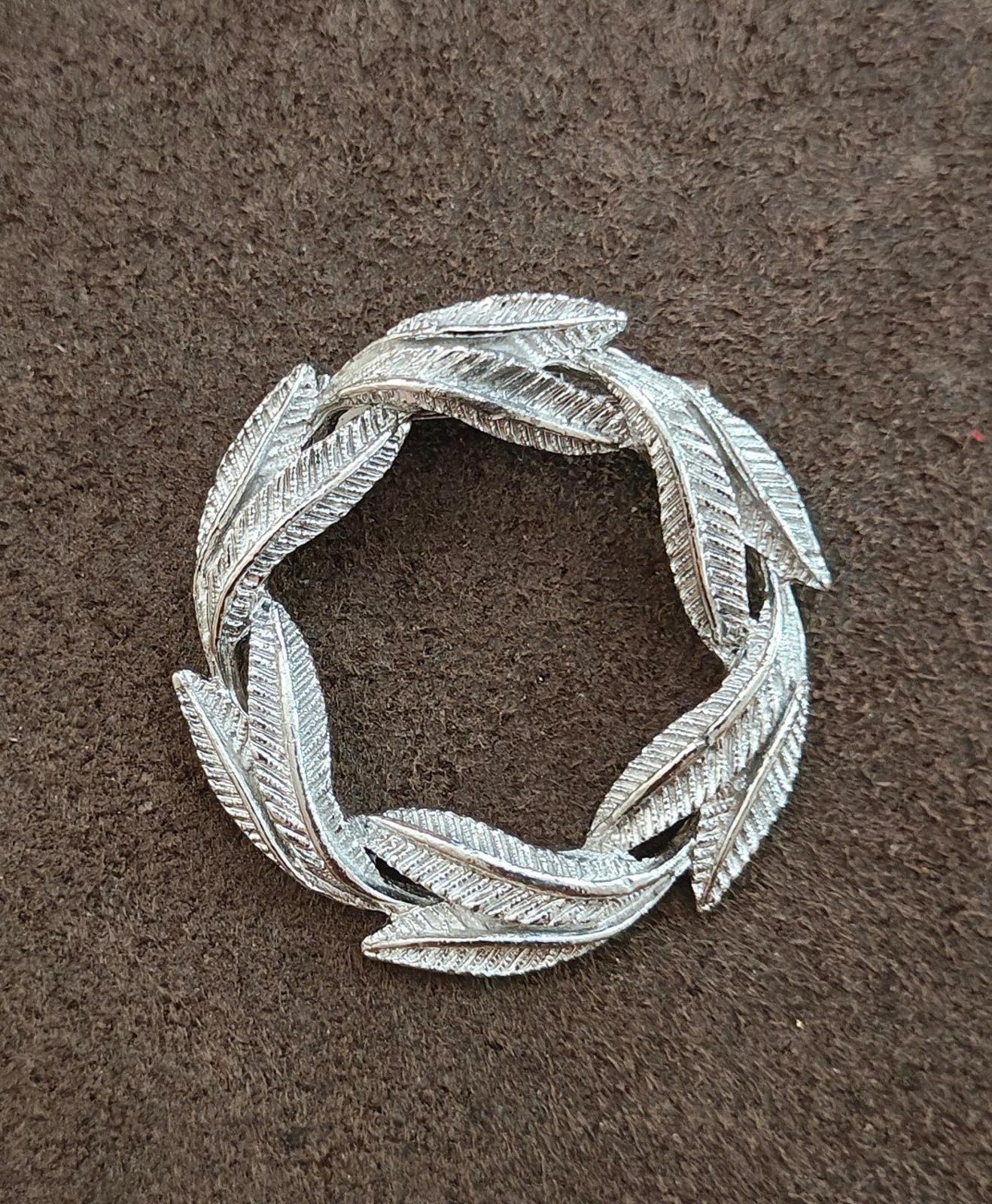 Silver-tone circular leaf wreath pin brooch with open square center
