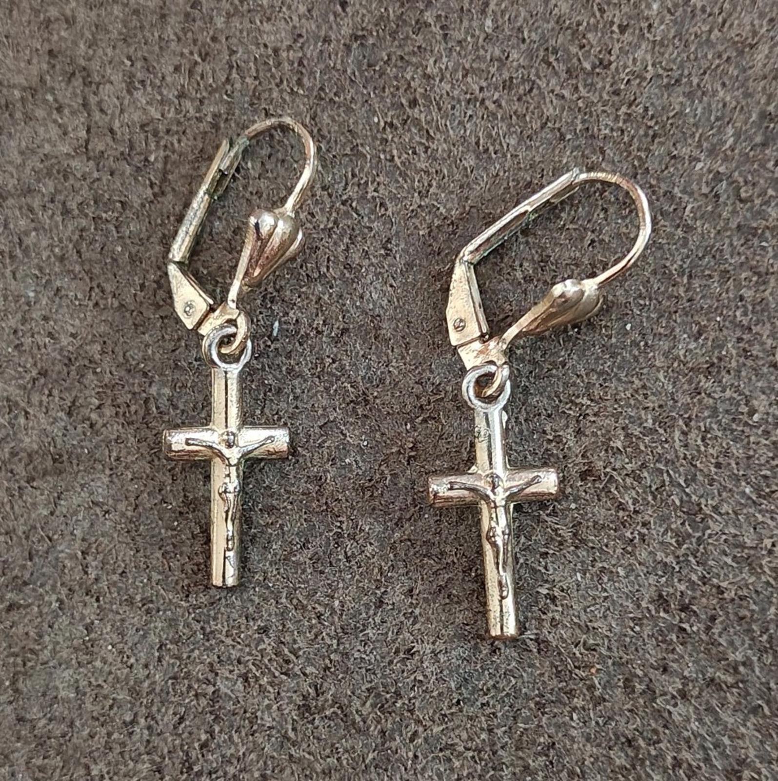 Silver-tone cross drop earrings with heart top charms and lever hook backs.