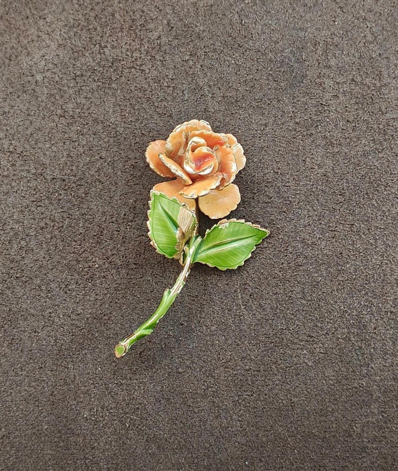 Gold-tone enamel rose and leaf pin, orange petals and green leaves with small stem tip