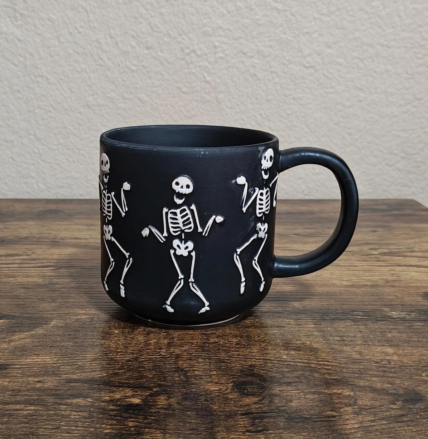 Dancing Skeletons Black Earthenware 13 oz 3D Embossed Black Mug.