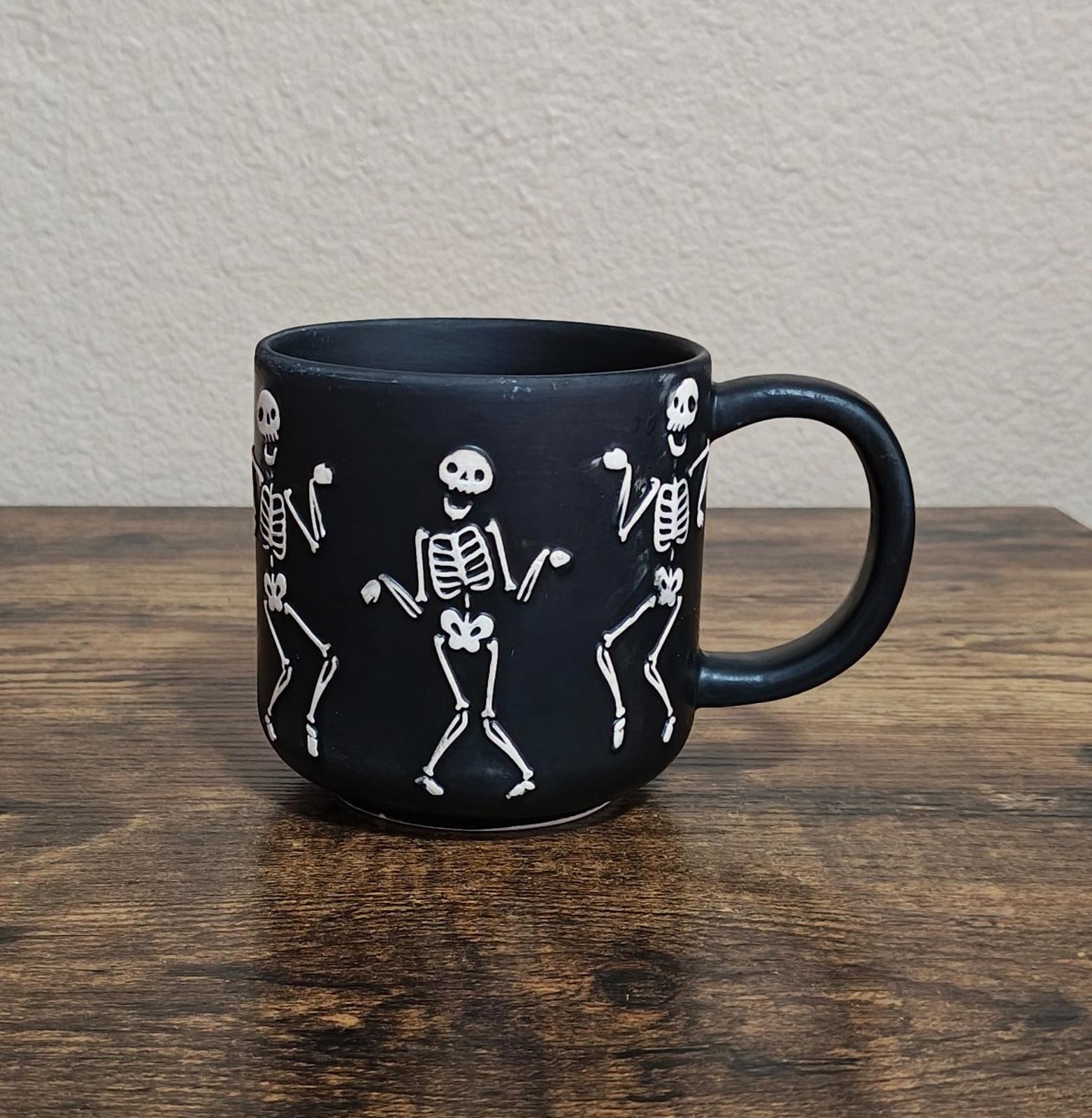 Dancing Skeletons Black Earthenware 13 oz 3D Embossed Black Mug.