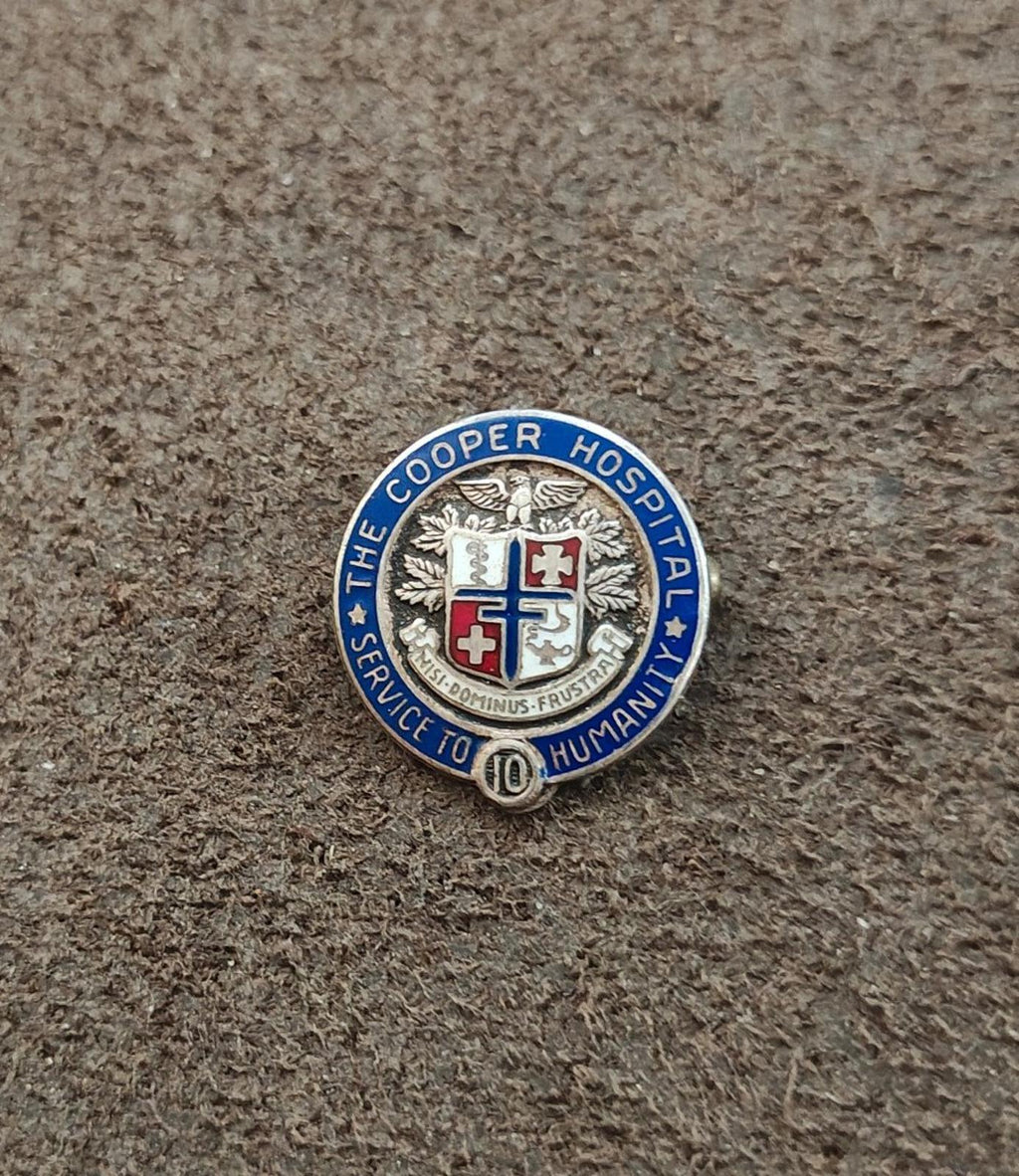Cooper Hospital service award pin, small round design with blue enamel border