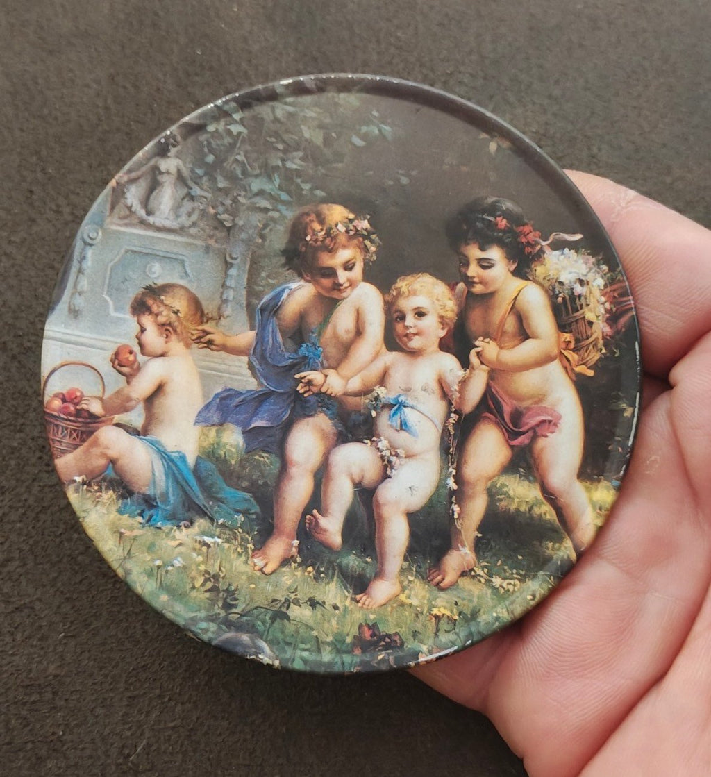 Trippie’s Inc 1995 Cherubs at Play Metal Coaster - Hans Zabateri Putti Angel Art